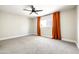 Comfortable carpeted bedroom with natural light, featuring a modern ceiling fan at 6174 E Janice Way, Scottsdale, AZ 85254