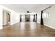 Open living room featuring a stone fireplace, hardwood floors, neutral paint and lots of natural light at 6174 E Janice Way, Scottsdale, AZ 85254