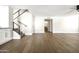 Spacious living room featuring a modern staircase, hardwood floors and an open concept design at 6174 E Janice Way, Scottsdale, AZ 85254