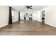 Large living room with hardwood floors, neutral paint and open concept design with view to kitchen at 6174 E Janice Way, Scottsdale, AZ 85254