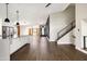 Spacious living room featuring hardwood floors, staircase and an open design with plenty of natural light at 6174 E Janice Way, Scottsdale, AZ 85254
