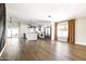 Spacious open concept living space featuring hardwood floors, modern lighting, and a kitchen at 6174 E Janice Way, Scottsdale, AZ 85254
