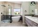 Modern main bathroom featuring a freestanding tub, glass shower, and stylish vanity at 6174 E Janice Way, Scottsdale, AZ 85254