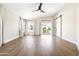 Bright main bedroom boasts hardwood floors, high ceilings, and a sliding barn door to the ensuite bathroom at 6174 E Janice Way, Scottsdale, AZ 85254