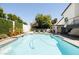 Serene pool area with lounge chairs, greenery, and a modern white home providing a private oasis at 6174 E Janice Way, Scottsdale, AZ 85254