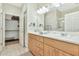 Bathroom showcasing double vanity, bright lights, and walk-in closet at 6535 E Superstition Springs Blvd # 146, Mesa, AZ 85206