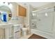 Bright bathroom featuring a glass enclosed shower, pedestal sink, and neutral tile flooring at 6535 E Superstition Springs Blvd # 146, Mesa, AZ 85206