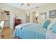 Bedroom featuring a queen-size bed, wood floors, and a ceiling fan at 6535 E Superstition Springs Blvd # 146, Mesa, AZ 85206