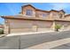 Inviting townhome features multiple garages and classic Southwestern architecture with tile roof at 6535 E Superstition Springs Blvd # 146, Mesa, AZ 85206