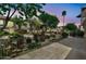 Scenic walkway with lush greenery and a rock water feature adds tranquility to the condos at 6535 E Superstition Springs Blvd # 146, Mesa, AZ 85206