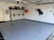 Spacious garage with epoxy flooring and built-in storage cabinets offers great organization at 6535 E Superstition Springs Blvd # 146, Mesa, AZ 85206