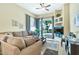 Bright living room features open patio doors, tile floors, and comfortable furnishings at 6535 E Superstition Springs Blvd # 146, Mesa, AZ 85206
