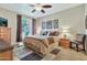 Main bedroom featuring a ceiling fan, and balcony access at 6535 E Superstition Springs Blvd # 146, Mesa, AZ 85206