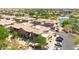 Aerial view of modern townhomes featuring desert landscaping, tile roofs, and attached garages at 6535 E Superstition Springs Blvd # 146, Mesa, AZ 85206