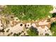 Aerial view of a tranquil water feature with rocks, plants, and lush landscaping in a park-like setting at 6535 E Superstition Springs Blvd # 146, Mesa, AZ 85206