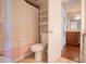 Bathroom featuring a toilet with a pink striped shower curtain at 7126 N 19Th Ave # 122, Phoenix, AZ 85021