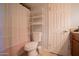 Cozy bathroom featuring a toilet, shelving, and shower with striped curtain at 7126 N 19Th Ave # 122, Phoenix, AZ 85021