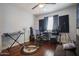 This bedroom features a ceiling fan, hardwood floors, and music themed decor at 7126 N 19Th Ave # 122, Phoenix, AZ 85021
