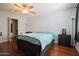 Bedroom with hardwood floors, a queen sized bed and a ceiling fan at 7126 N 19Th Ave # 122, Phoenix, AZ 85021