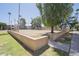 Common grass area with mature trees and a playground at 7126 N 19Th Ave # 122, Phoenix, AZ 85021