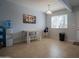 A simply furnished dining area with tile flooring, a wooden table, and a bench at 7126 N 19Th Ave # 122, Phoenix, AZ 85021