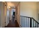 Hallway with hardwood floors and white walls that leads into other rooms at 7126 N 19Th Ave # 122, Phoenix, AZ 85021