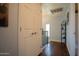 Hallway with hardwood floors and access to a closet with plenty of storage space at 7126 N 19Th Ave # 122, Phoenix, AZ 85021