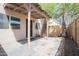 View of covered patio with concrete flooring, fence, and exterior access at 7126 N 19Th Ave # 122, Phoenix, AZ 85021