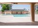 Community pool with clear blue water and a well-maintained deck at 7126 N 19Th Ave # 122, Phoenix, AZ 85021