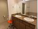 Bathroom featuring a double sink vanity with granite countertops and modern fixtures at 7609 E Indian Bend Rd # 1012, Scottsdale, AZ 85250