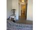 Bedroom featuring tile flooring, lamp, and a glimpse into the bathroom at 7609 E Indian Bend Rd # 1012, Scottsdale, AZ 85250