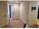 Entryway with tile floors, decorative glass, and a white door leading into a condo unit at 7609 E Indian Bend Rd # 1012, Scottsdale, AZ 85250