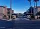 Apartment buildings with palm trees and covered parking show the front of the condo complex at 7609 E Indian Bend Rd # 1012, Scottsdale, AZ 85250
