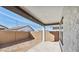 Covered patio area in a spacious backyard with block fencing and ample room to create your outdoor retreat at 7657 W Minton St, Laveen, AZ 85339