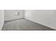 Neutral bedroom with carpet, white walls, and a window offering natural light at 7657 W Minton St, Laveen, AZ 85339