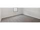 Bright bedroom with gray carpet, a single window, and clean white walls at 7657 W Minton St, Laveen, AZ 85339