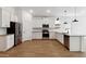 Spacious kitchen with stainless steel appliances, white cabinets, and a stylish backsplash at 7657 W Minton St, Laveen, AZ 85339