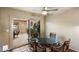 Dining room featuring a glass table with chairs, and a view of the outdoor patio at 7746 E Bisbee Rd, Scottsdale, AZ 85258