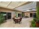 Covered patio with dining and lounge furniture, creating an inviting outdoor living space at 7746 E Bisbee Rd, Scottsdale, AZ 85258