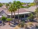 Aerial view of a home with a pool, covered patio, and view of surrounding neighborhood at 80 S Laura Ln, Casa Grande, AZ 85194
