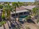 Aerial view of a home with a pool, covered patio, and view of surrounding neighborhood at 80 S Laura Ln, Casa Grande, AZ 85194