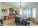 Dining room with seating for six, hutch and window with shutters at 80 S Laura Ln, Casa Grande, AZ 85194