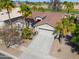 Aerial view of a single-story home with a two-car garage and desert landscaping at 80 S Laura Ln, Casa Grande, AZ 85194