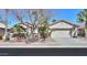 Charming single-Gathering home with a two-car garage, stone accents, and well-manicured desert landscaping at 80 S Laura Ln, Casa Grande, AZ 85194