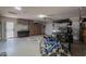 Spacious garage featuring storage cabinets, workbench, and ample room for parking and hobbies at 80 S Laura Ln, Casa Grande, AZ 85194
