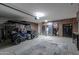 Well-organized garage with golf cart, epoxy floor, custom cabinets, and ample storage space at 80 S Laura Ln, Casa Grande, AZ 85194