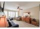 Cozy living room with a comfortable sofa, recliner, and stylish wooden dresser at 80 S Laura Ln, Casa Grande, AZ 85194
