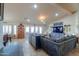 Open living room with beamed ceilings, large windows, and modern decor at 80 S Laura Ln, Casa Grande, AZ 85194