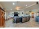 Open concept living room with beamed ceilings and modern furnishings at 80 S Laura Ln, Casa Grande, AZ 85194