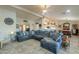Spacious living room featuring a sectional sofa and open floor plan at 80 S Laura Ln, Casa Grande, AZ 85194
